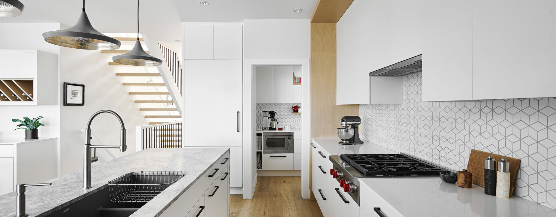 White custom kitchen cabinets and millwork installation in a Florida home